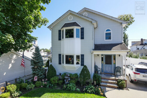 unique two identical bay window exterior in white trim