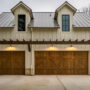 barn garage doors with a pergola over them
