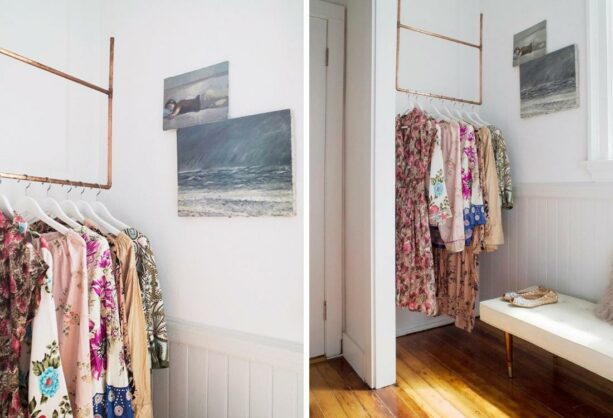 gold finished metal hanging clothes rack from ceiling