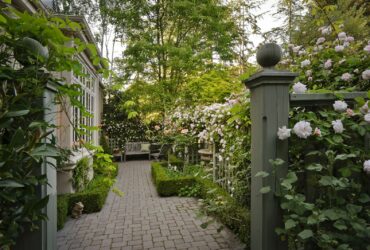 mediterranean style privacy side yard with a seating space