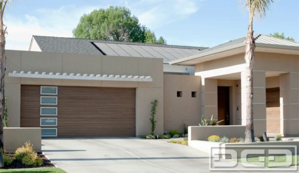 minimalist pergola over a wood panel modern garage door