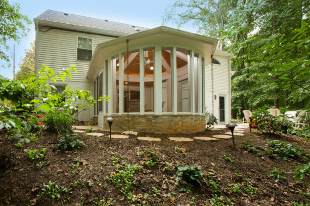 transitional small back porch with a stone accent