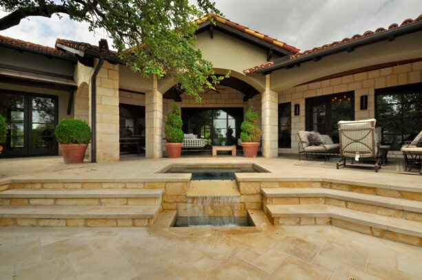 wide patio steps completed with a water feature as a focal point