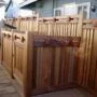 cedar craftsman-style fence with dumpster enclosure