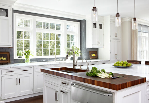 glass tile in a lunar gray color backsplash around a white kitchen window