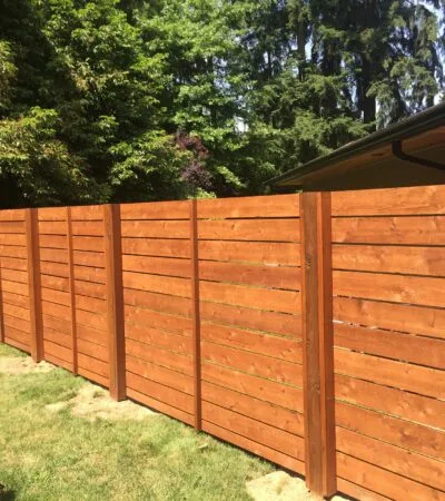 horizontally lain tight knot cedar fence in a mid-century modern style