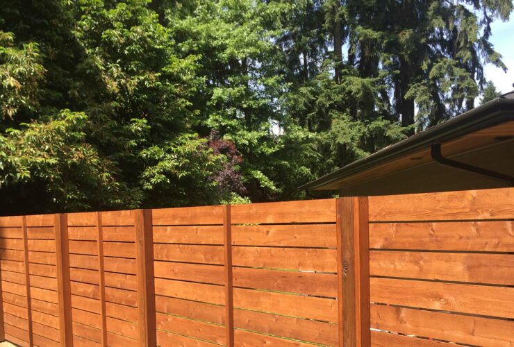 horizontally lain tight knot cedar fence in a mid-century modern style