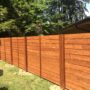 horizontally lain tight knot cedar fence in a mid-century modern style