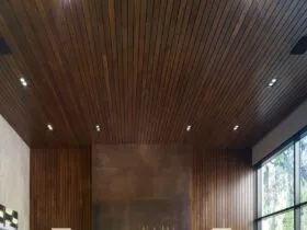 oxidized metal surround fireplace with wood wall and ceiling paneling