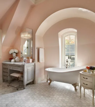 soft coral pink bathroom wall paired with gray furniture