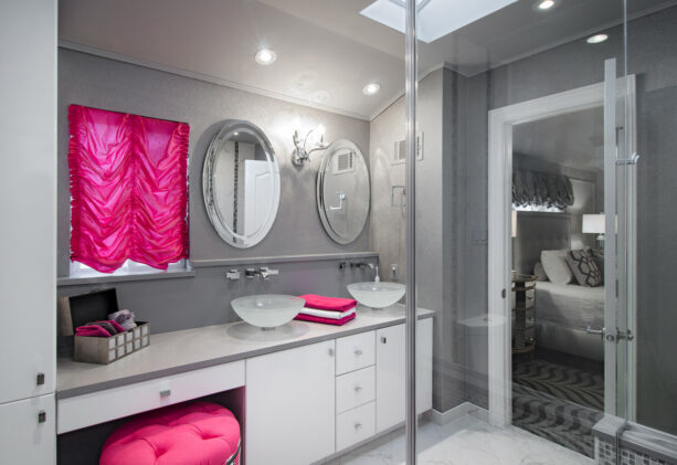 urban gray bathroom with a splash of bright pink as a decoration